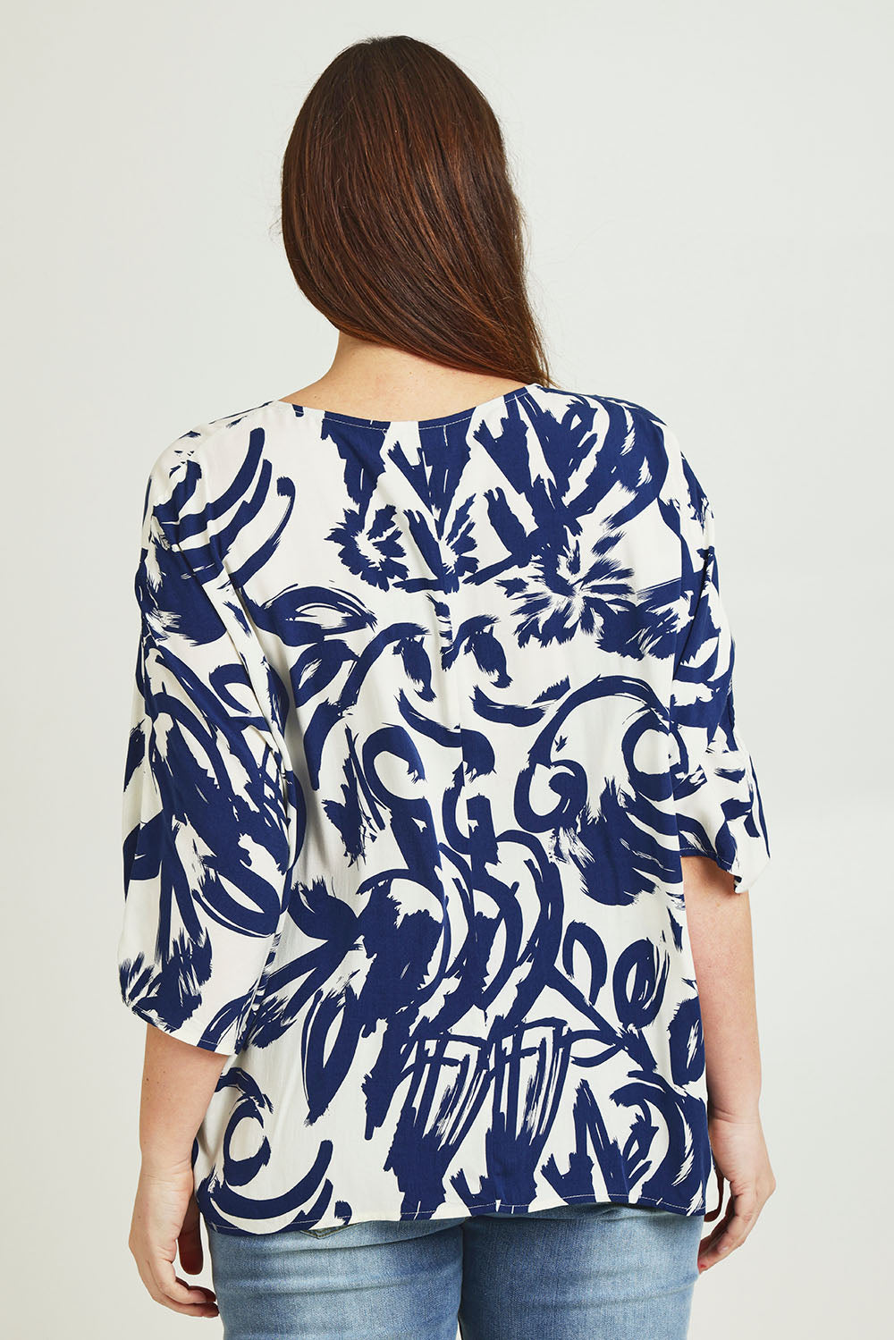 Model Jane wearing size 14 of The Woven Easywear Tee in colour Frenchblue (Blue), from the back