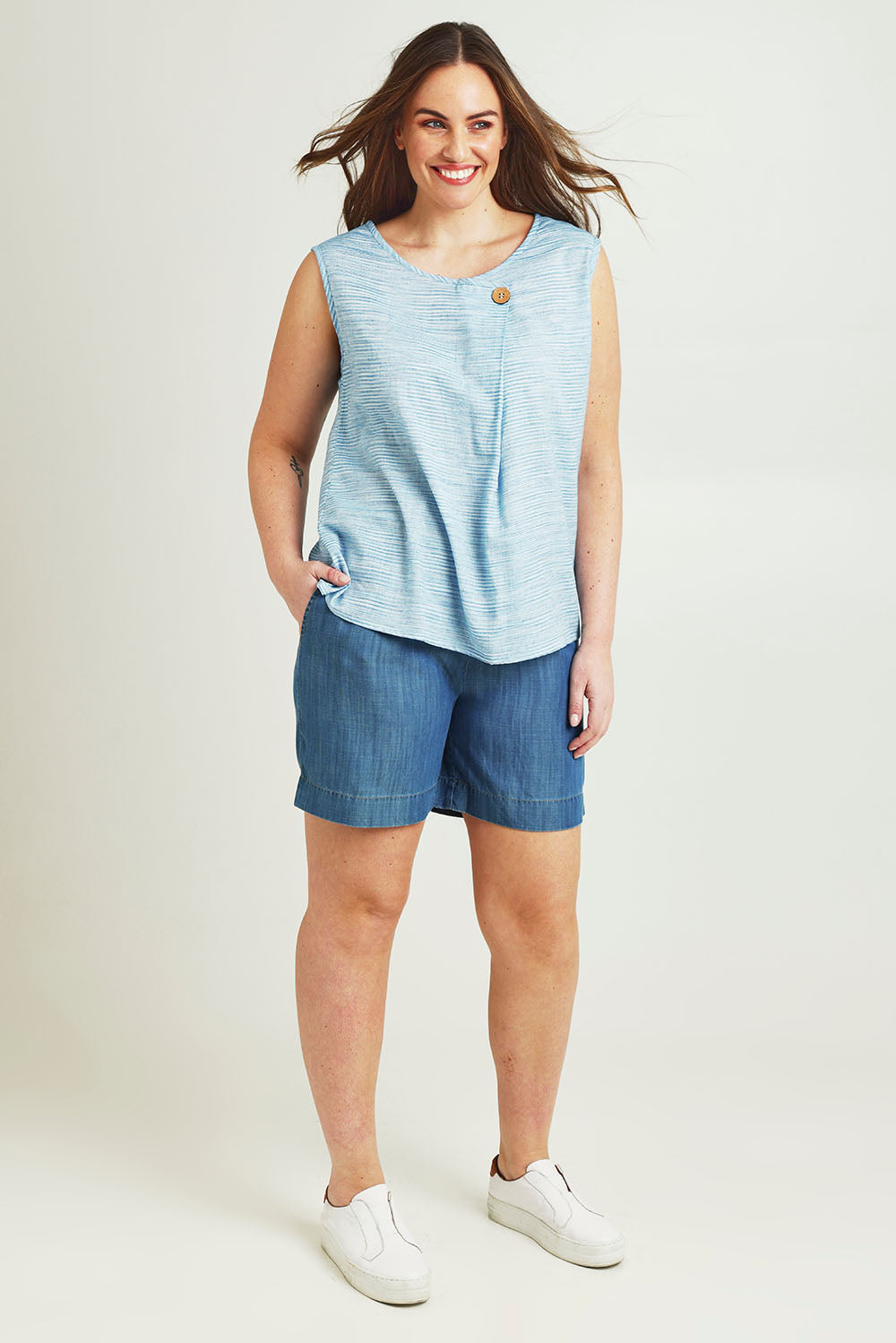 Model Jane wearing size 14 of The Shirred Waist Pull On Shorts in colour Denimblue (Blue), from the front, showing the whole outfit