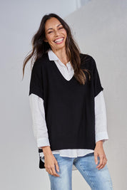 Model Amanda wearing size S of The All Season V Neck High Low Tee in colour Black (Black), from the front, showing the whole outfit