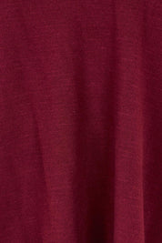 Product shot of The All Season V Neck High Low Tee in colour Sangria (Red), detail
