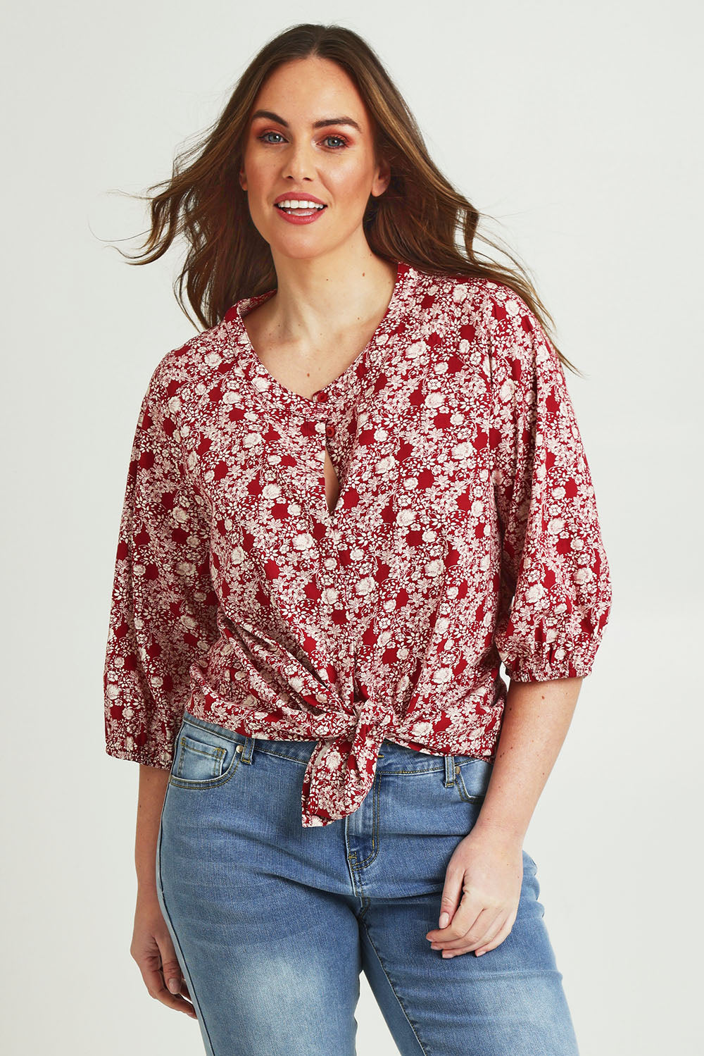 Model Jane wearing size 14 of The Relaxed Cotton Shirt in colour Raspberry (Red), from the front, cropped image