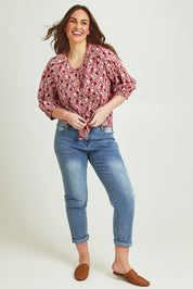 Model Jane wearing size 14 of The Relaxed Cotton Shirt in colour Raspberry (Red), from the front, showing the whole outfit