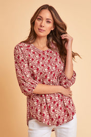Model Madeline wearing size 10 of The Relaxed Cotton Shirt in colour Raspberry (Red), from the front, showing the whole outfit