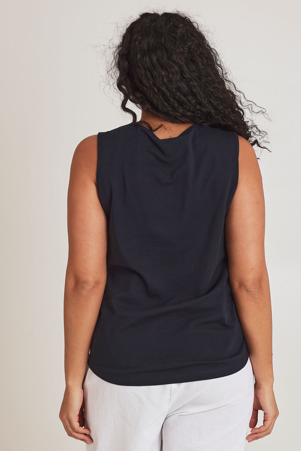 Model Terri-Leigh wearing size 14 of The Lace Trim Cotton Tank in colour Navy (Blue), from the back