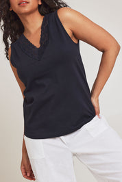 Model Terri-Leigh wearing size 14 of The Lace Trim Cotton Tank in colour Navy (Blue), from the front, cropped image