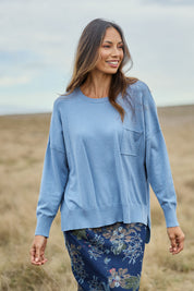 Model Amanda wearing size S of The Modal Blend Crew Neck Jumper in colour Denim (Blue), from the front, showing the whole outfit