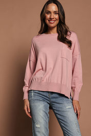 Model Madeline wearing size S of The Modal Blend Crew Neck Jumper in colour Rosepink (Pink), from the front, showing the whole outfit