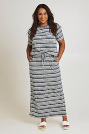 Model Ashleigh wearing size 16 of The Striped Pull On Skirt in colour Navystripe (Blue), from the front, showing the whole outfit