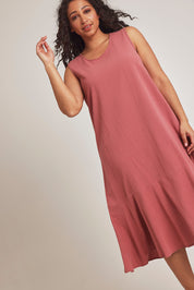 Model Terri-Leigh wearing size 14 of The Cotton Flounce Dress in colour Rose (Pink), from the front, cropped image