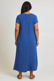 Model Ashleigh wearing size 16 of The Double Cotton Maxi Dress in colour Skyblue (Blue), from the back