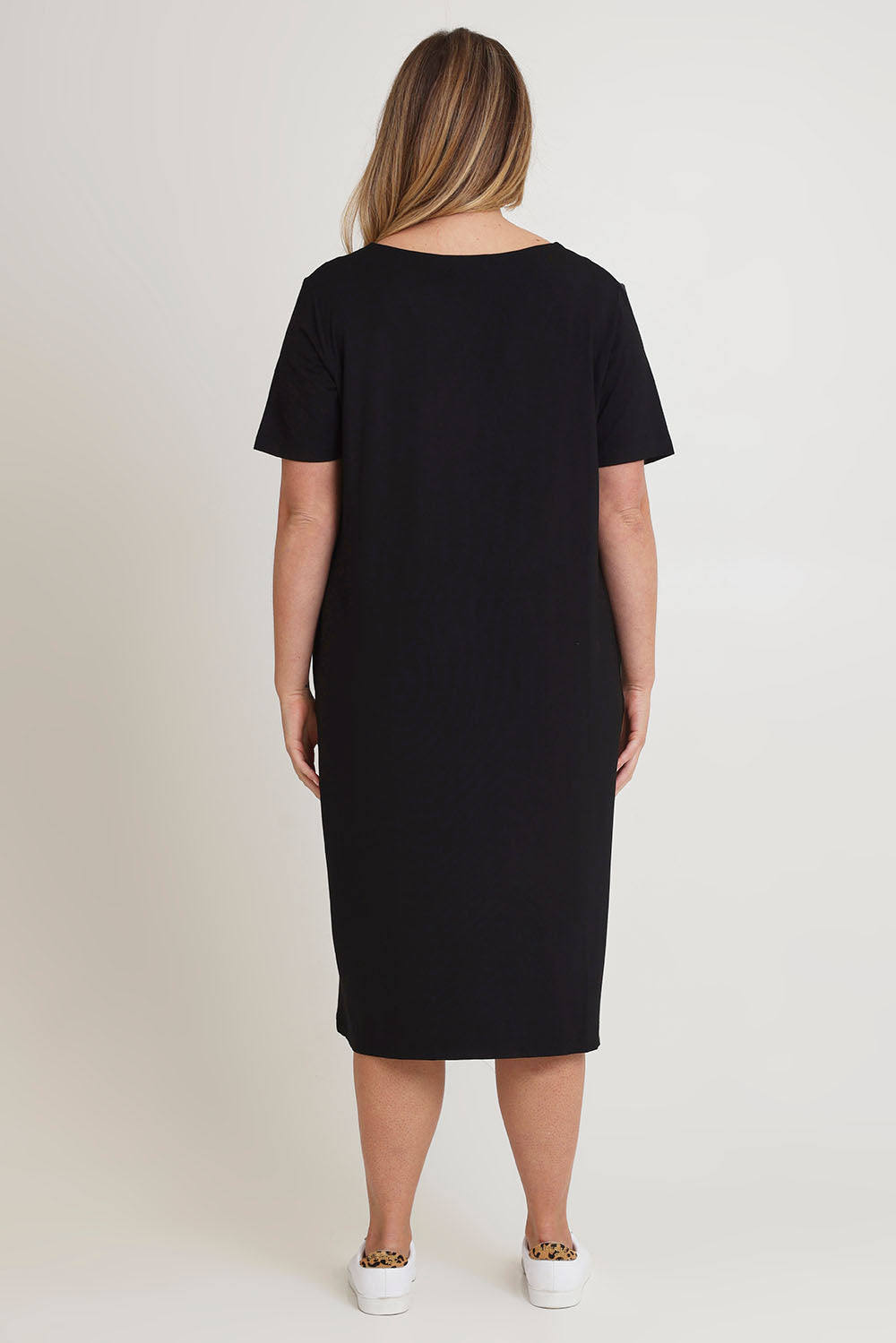 Model Chanel wearing size 16 of The Pack & Go Luxe Bamboo Button Up Dress with Pockets in colour Black (Black), from the back
