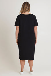 Model Chanel wearing size 16 of The Pack & Go Luxe Bamboo Button Up Dress with Pockets in colour Black (Black), from the back