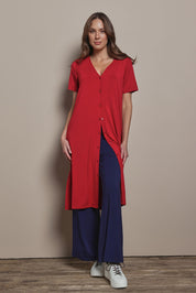 Model Madeline wearing size 10 of The Pack & Go Luxe Bamboo Button Up Dress with Pockets in colour Cherryred (Red), from the front, showing the whole outfit
