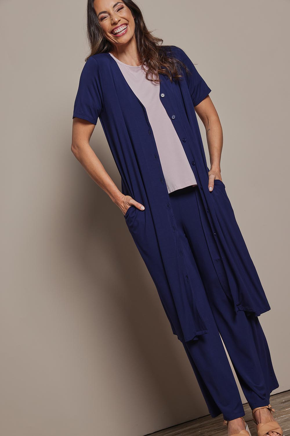 Model Amanda wearing size 10 of The Pack & Go Luxe Bamboo Button Up Dress with Pockets in colour Frenchnavy (Blue), from the front, showing the whole outfit