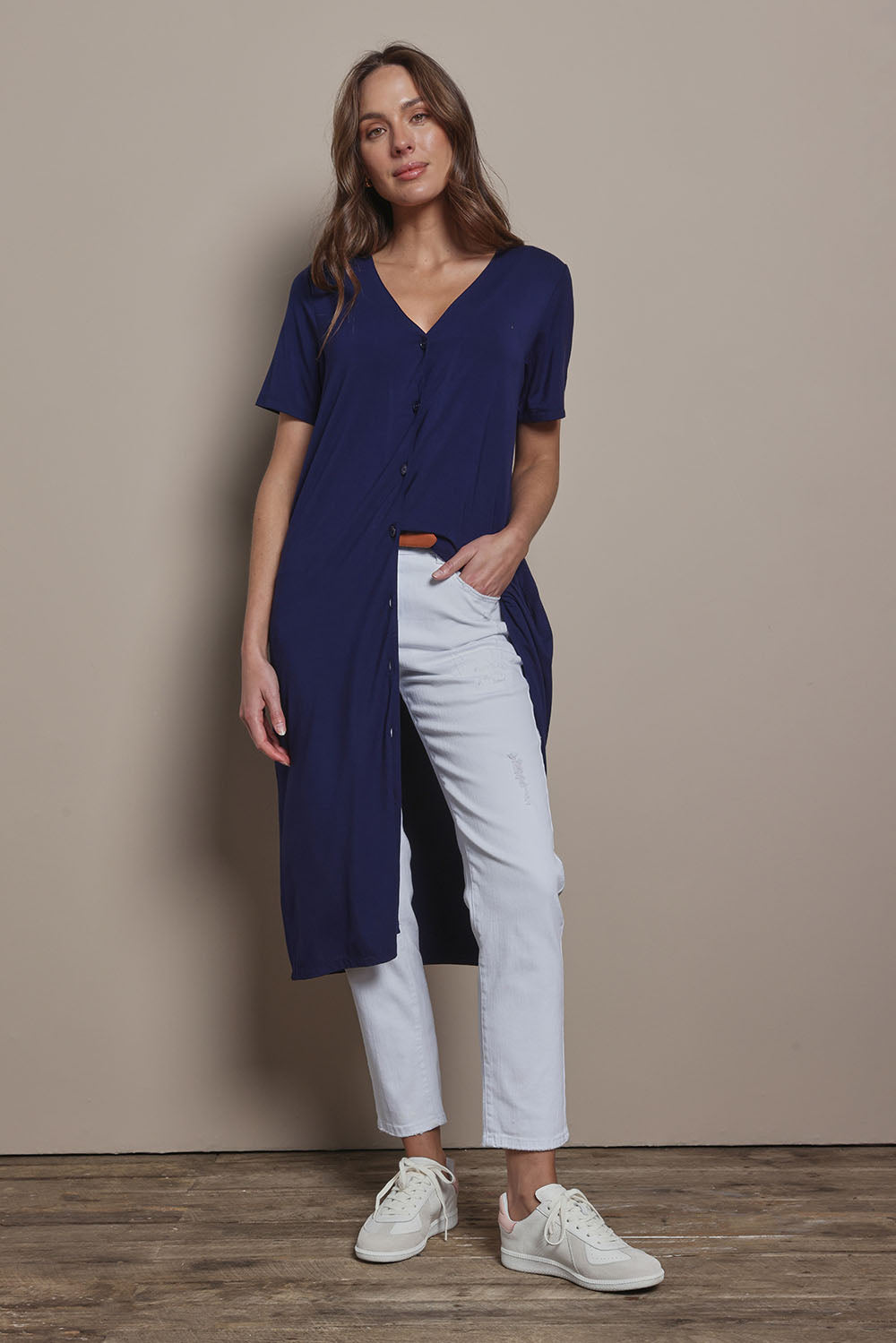 Model Madeline wearing size 10 of The Pack & Go Luxe Bamboo Button Up Dress with Pockets in colour Frenchnavy (Blue), from the front, showing the whole outfit