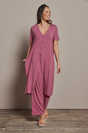 Model Amanda wearing size 10 of The Pack & Go Luxe Bamboo Button Up Dress with Pockets in colour Smokeyrose (Pink), from the front, showing the whole outfit