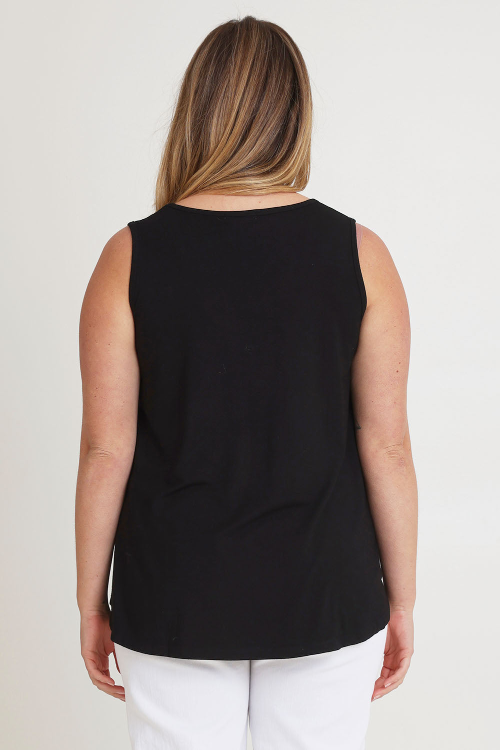Model Chanel wearing size 16 of The Pack & Go Luxe Bamboo Swing Tank in colour Black (Black), from the back
