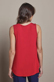 Model Madeline wearing size 10 of The Pack & Go Luxe Bamboo Swing Tank in colour Cherryred (Red), from the back