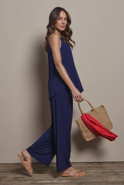 Model Madeline wearing size 10 of The Pack & Go Luxe Bamboo Swing Tank in colour Frenchnavy (Blue), from the front, showing the whole outfit