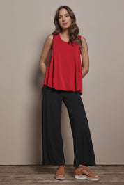 Model Madeline wearing size 10 of The Pack & Go Luxe Bamboo Wide Leg Pant in colour Black (Black), from the front, showing the whole outfit