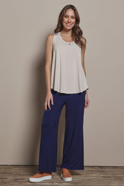 Model Madeline wearing size 10 of The Pack & Go Luxe Bamboo Wide Leg Pant in colour Frenchnavy (Blue), from the front, showing the whole outfit