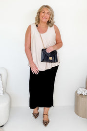 Model Bev wearing size 14 of The Pack & Go Luxe Bamboo Pull On Maxi Skirt in colour Black (Black), from the front, showing the whole outfit