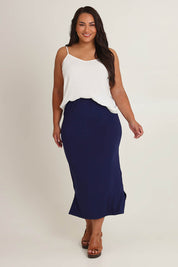 Model Ashleigh wearing size 16 of The Pack & Go Luxe Bamboo Pull On Maxi Skirt in colour Frenchnavy (Blue), from the front, showing the whole outfit