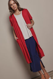 Model Madeline wearing size 10 of The Pack & Go Luxe Bamboo Pull On Maxi Skirt in colour Frenchnavy (Blue), from the front, showing the whole outfit