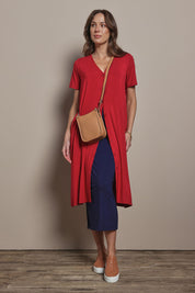 Model Madeline wearing size 10 of The Pack & Go Luxe Bamboo Pull On Maxi Skirt in colour Frenchnavy (Blue), from the front, showing the whole outfit