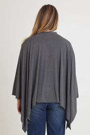 Model Chanel wearing The Pack & Go Luxe Bamboo Shrug in colour Charcoal (Grey), from the back