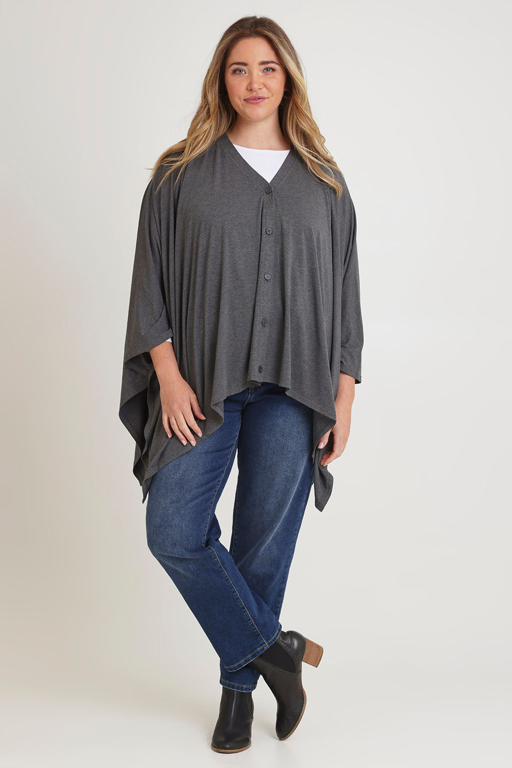 Model Chanel wearing The Pack & Go Luxe Bamboo Shrug in colour Charcoal (Grey), from the front, showing the whole outfit