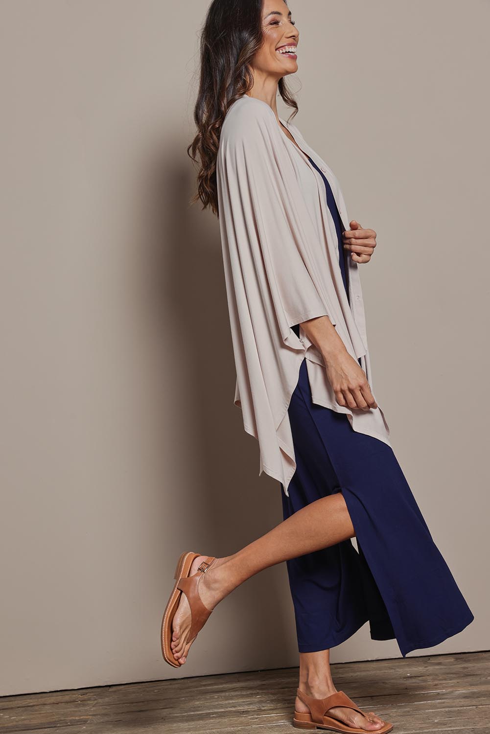 Model Amanda wearing The Pack & Go Luxe Bamboo Shrug in colour Nougat, from the front, showing the whole outfit