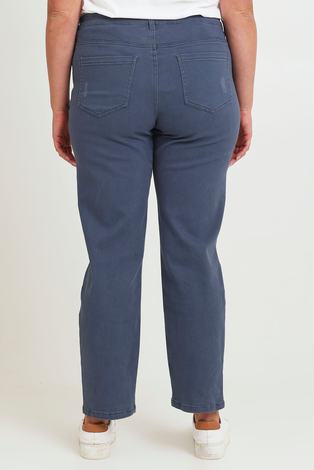 Model Chanel wearing size 16 of The Distressed Coloured Jean in colour Bluesteel (Blue), from the back
