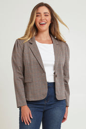 Model Chanel wearing size 16 of The Classic Houndstooth Blazer in colour Tanblack, from the front, cropped image