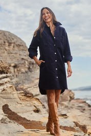 Model Amanda wearing size 10 of The Cord Shacket Dress With Pockets in colour Darknavy (Blue), from the front, showing the whole outfit