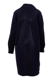Product shot of The Cord Shacket Dress With Pockets in colour Darknavy (Blue), from the back