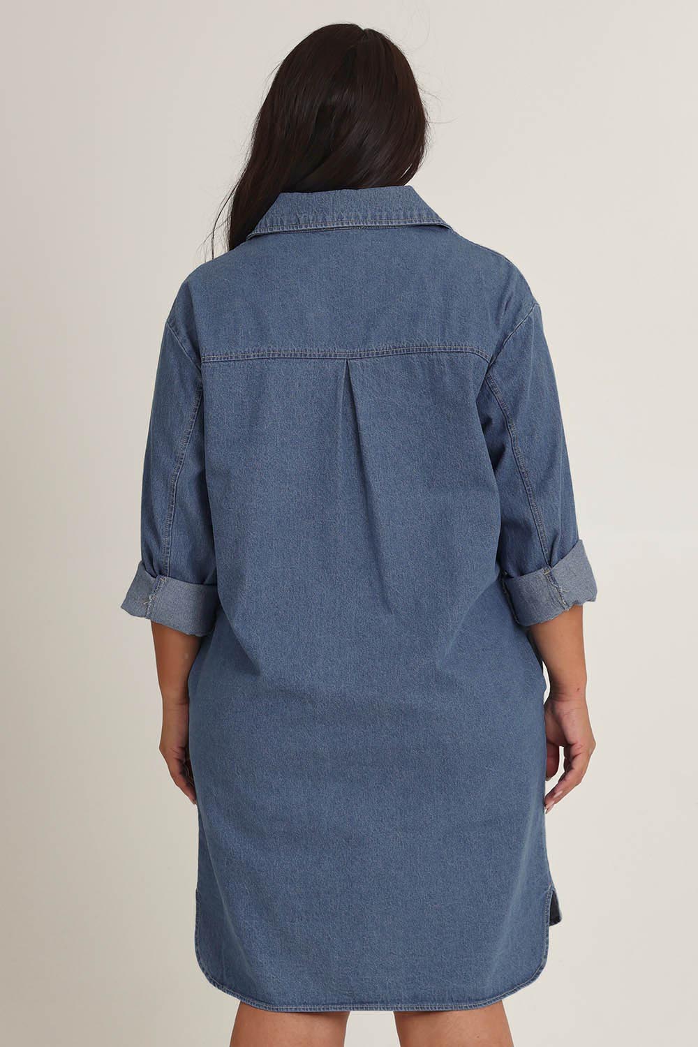 Model Ashleighf wearing size 16 of the The Denim Shacket Dress With Pockets - Denimblue in colour Denimblue, from the back