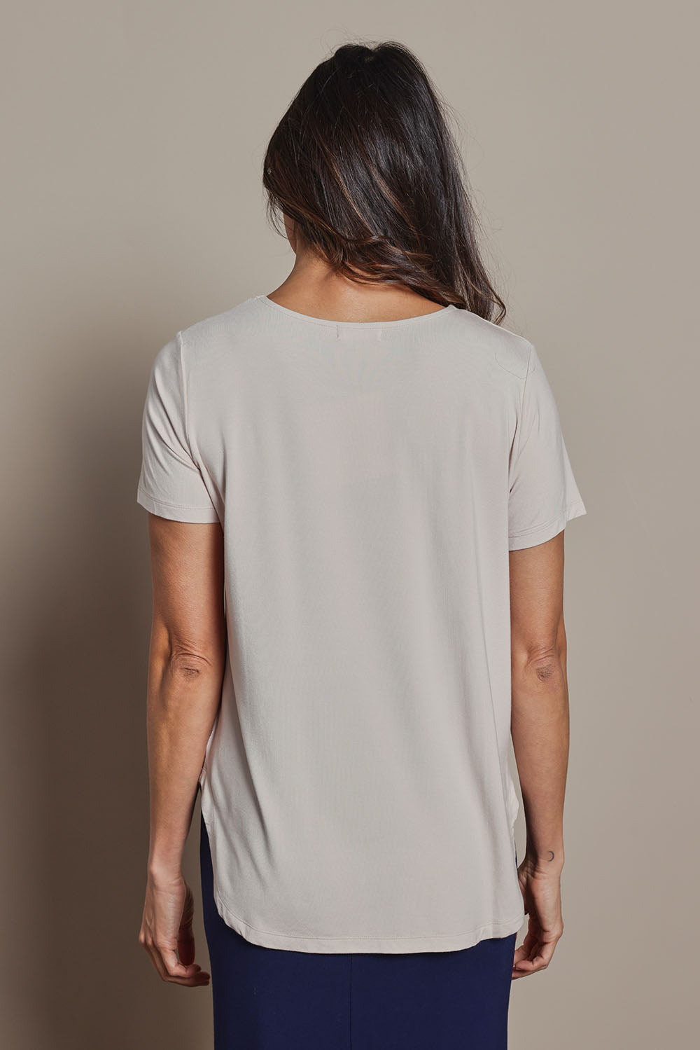 Model Amanda wearing size 10 of The Pack & Go Luxe Bamboo Tee in colour Nougat, from the back