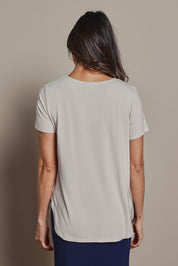 Model Amanda wearing size 10 of The Pack & Go Luxe Bamboo Tee in colour Nougat, from the back