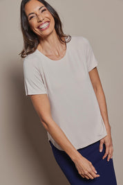 Model Amanda wearing size 10 of The Pack & Go Luxe Bamboo Tee in colour Nougat, from the front, cropped image