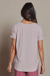 Model Amanda wearing size 10 of The Pack & Go Luxe Bamboo Tee in colour Roseblush (Pink), from the back