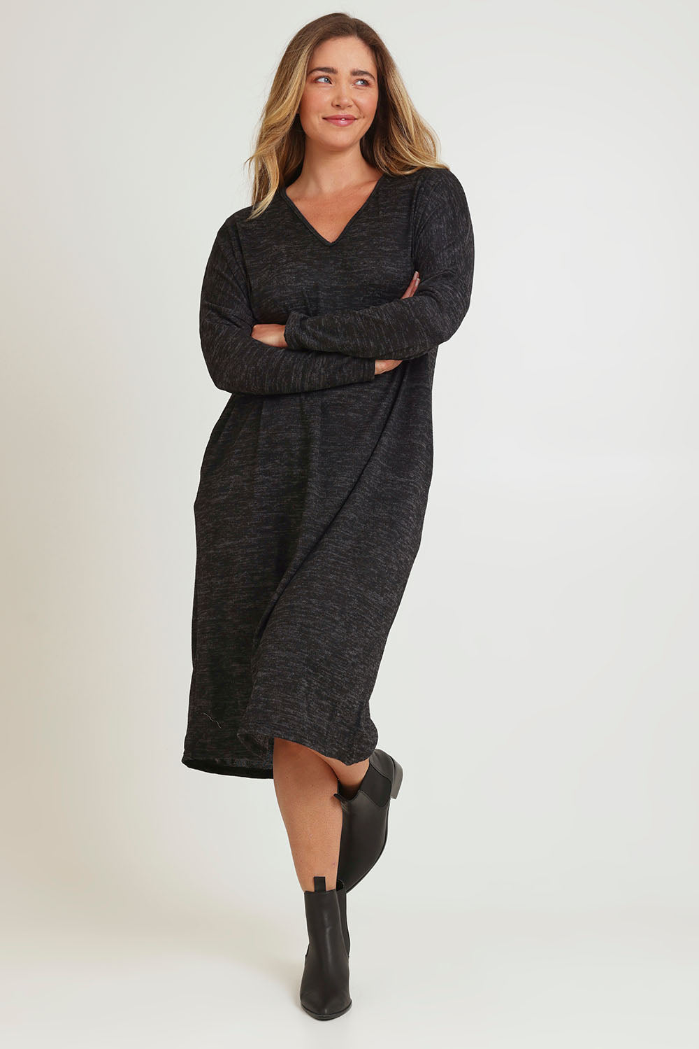 Model Chanel wearing size 16 of The Relaxed L/S Tee Dress With Pockets in colour Blackmarle (Black), from the front, showing the whole outfit