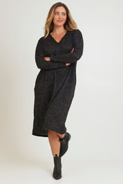 Model Chanel wearing size 16 of The Relaxed L/S Tee Dress With Pockets in colour Blackmarle (Black), from the front, showing the whole outfit