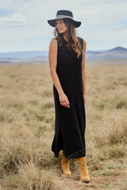 Model Amanda wearing size S of The Mock Turtle Cable Maxi Dress in colour Black (Black), from the front, showing the whole outfit