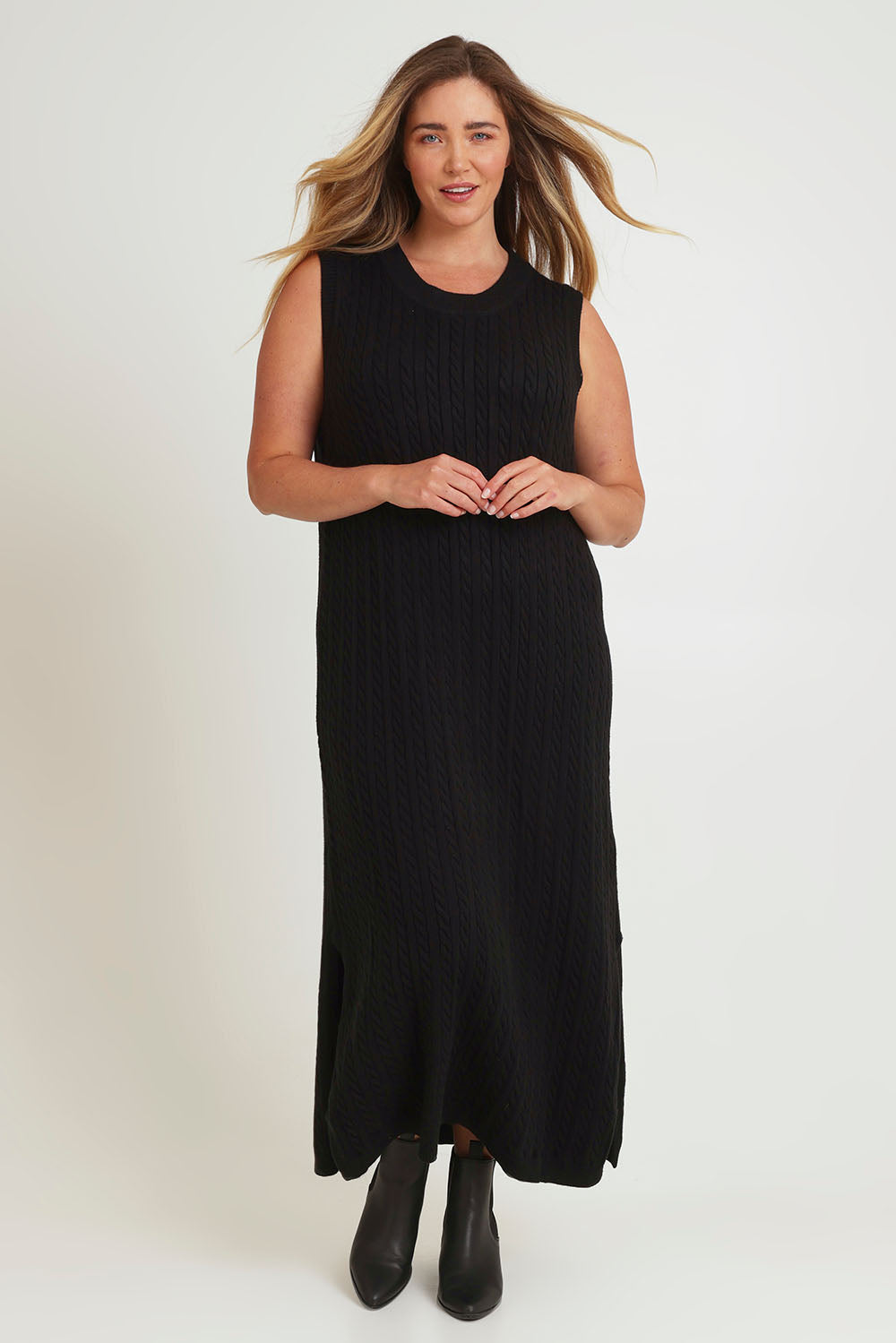Model Chanel wearing size XL of The Mock Turtle Cable Maxi Dress in colour Black (Black), from the front, showing the whole outfit