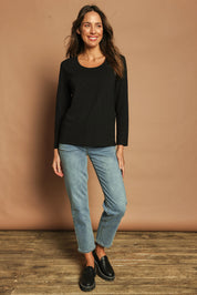 Model Madeline wearing size 10 of The Classic Long Sleeve Tee in colour Black (Black), from the front, showing the whole outfit
