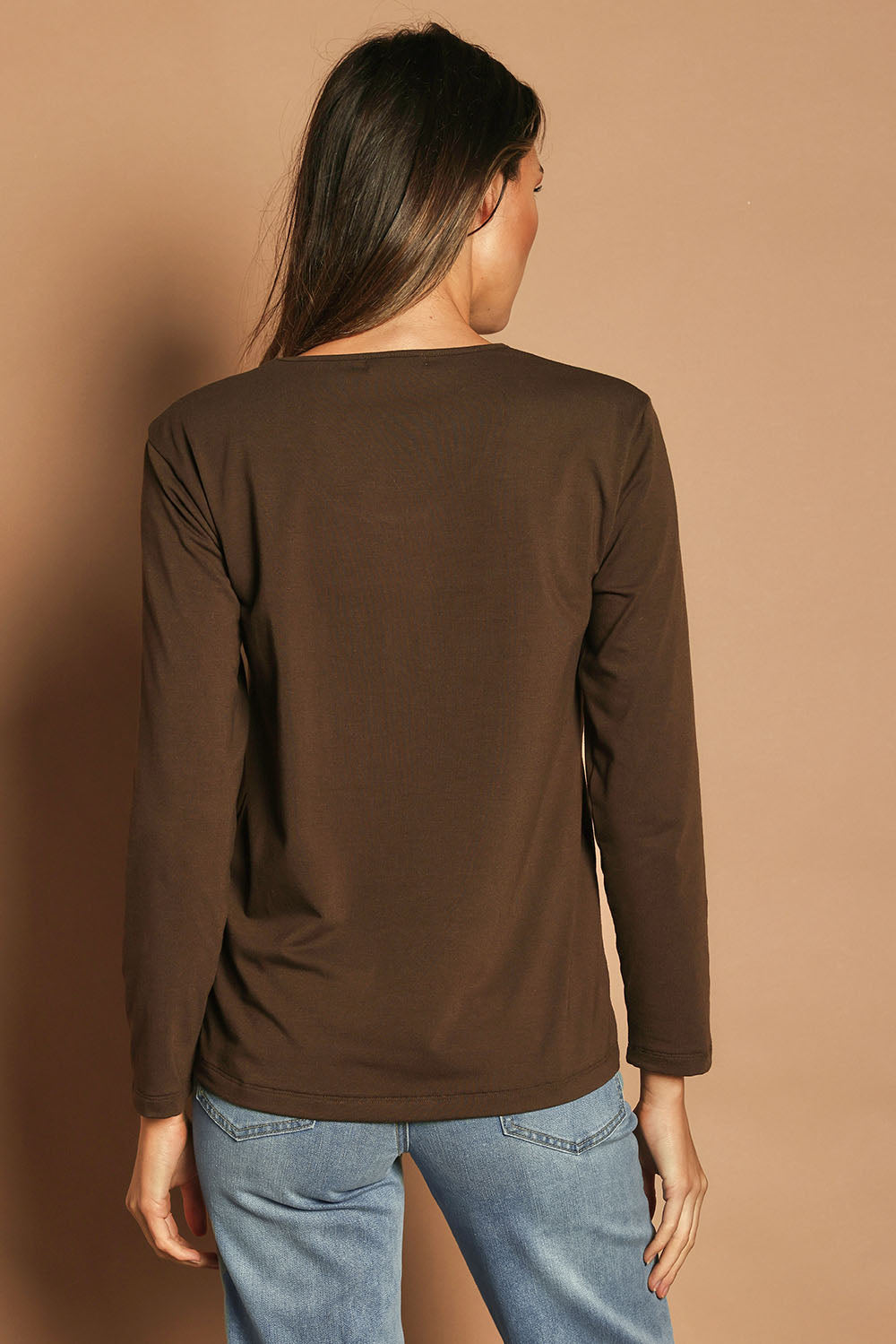 Model Madeline wearing size 10 of The Classic Long Sleeve Tee in colour Cocoa, from the back