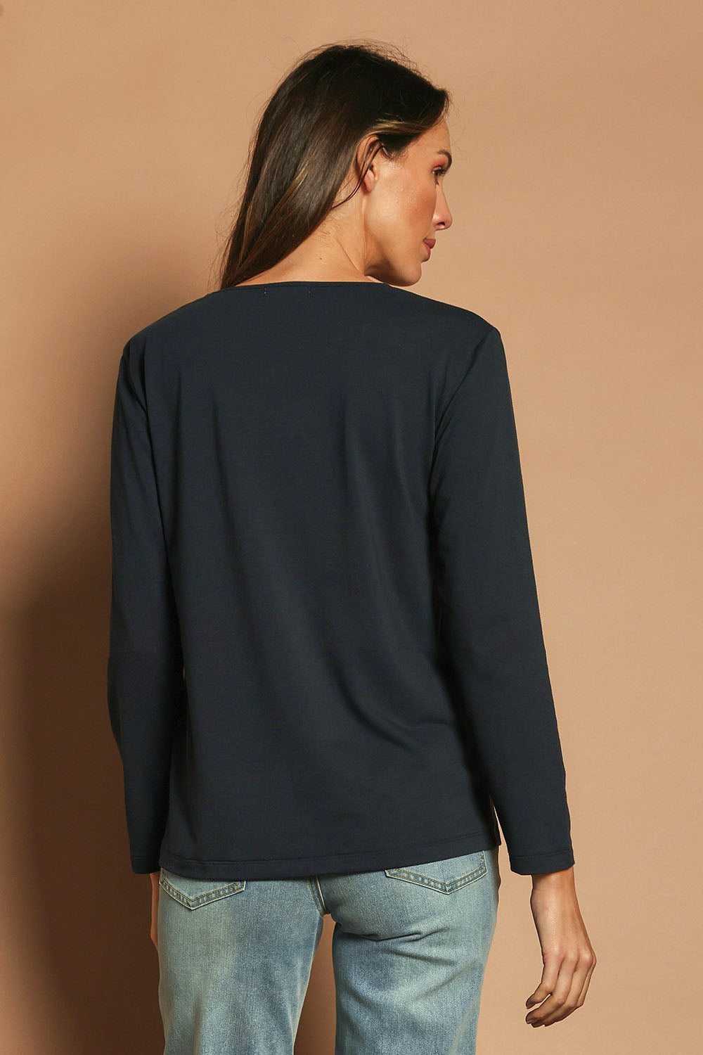 Model Madeline wearing size 10 of The Classic Long Sleeve Tee in colour Darknavy (Blue), from the back