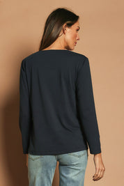 Model Madeline wearing size 10 of The Classic Long Sleeve Tee in colour Darknavy (Blue), from the back