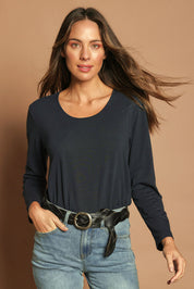 Model Madeline wearing size 10 of The Classic Long Sleeve Tee in colour Darknavy (Blue), from the front, cropped image